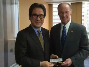 Gov. Bentley presents Hiroyuki Ishige, CEO of JETRO, with a pen made from a dogwood downed by the 2011 Tuscaloosa tornado. 