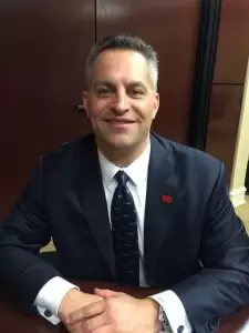 George Kollitides, Chairman and CEO of Remington Outdoor Company, pictured with the Alabama Dept. of Commerce "Made In Alabama" lapel pin before announcing the company's expansion plans in Huntsville, Ala.