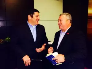 Commerce Secretary Greg Canfield, right, speaks to Roger Wehner, director of the Mobile Airport Authority, at a breakfast to kick off Team Alabama's mission at the Farnborough Airshow.