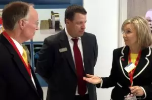 Elmore County economic developer Leisa Finley speaks to Gov. Bentley and GKN's Kasey Myers.
