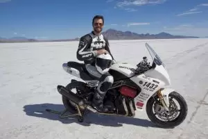 Co-founder Brian Case sits on one of the bikes at the Bonneville Salt Flats. (Motus photo)