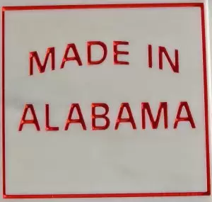 One of the gifts presented at a ceremony to mark the launch of the Sylacauga Marble Quarry was a small square of marble with the Made in Alabama logo.