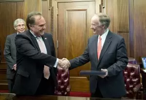 Gov. Robert Bentley, right, shakes hands with Ambassador of Peru Harold Forsyth.