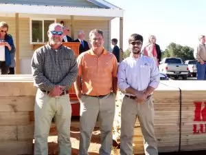 The principals of K&S Lumber pose at the ribbon cutting.