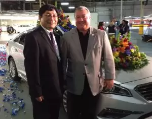 Hyundai Alabama President Kim and Commerce Secretary Canfield pose with the 3 millionth Alabama-made Hyundai vehicle.