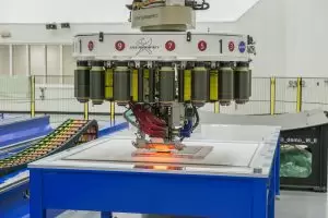 The robot’s head has 16 spools of composite fiber tape that it releases in precise patterns to make both small and large objects. (Credit: NASA/MSFC/Fred Deaton)