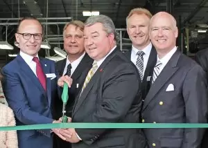 Alabama Commerce Secretary Greg Canfield, center, joined REHAU officials to mark the completion of an expansion project at the company's Cullman plant and a groundbreaking ceremony to launch construction of a technical center.