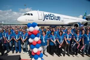 Airbus' Alabama workers sported a football jersey for the delivery of 'BluesMobile' to JetBlue.