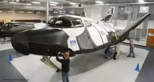 Technicians inspect the Dream Chaser spaceplane. (Image: Sierra Nevada Corp.)