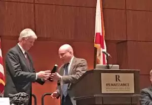 Commerce's Bob Smith presents Forrest Wright with the Dave Echols Distinguished Service Award at the EDAA conference.