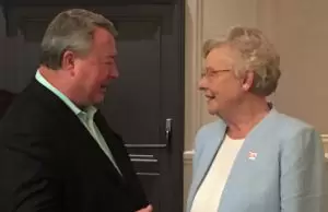 Commerce Secretary Canfield speaks to Gov. Kay Ivey after the Paris Air Show kick-off breakfast.