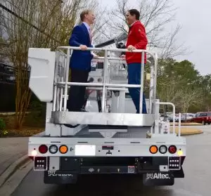 Jay Timmons, president of the National Association of Manufacturers, right, speaks with Altec Inc. CEO Lee Styslinger III during NAM's 2018 'State of Manufacturing' tour stop in Birmingham. 