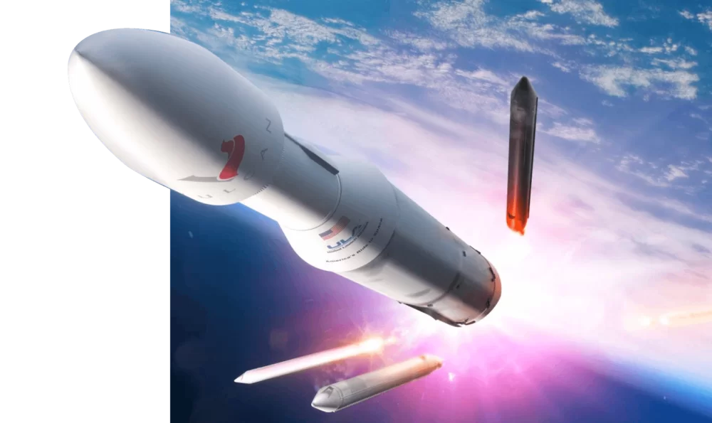 A Vulcan Centaur rocket high dropping its boosters above the earth.