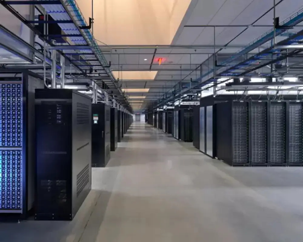 Several rows of 6 foot tall computer racks in a data center environment.